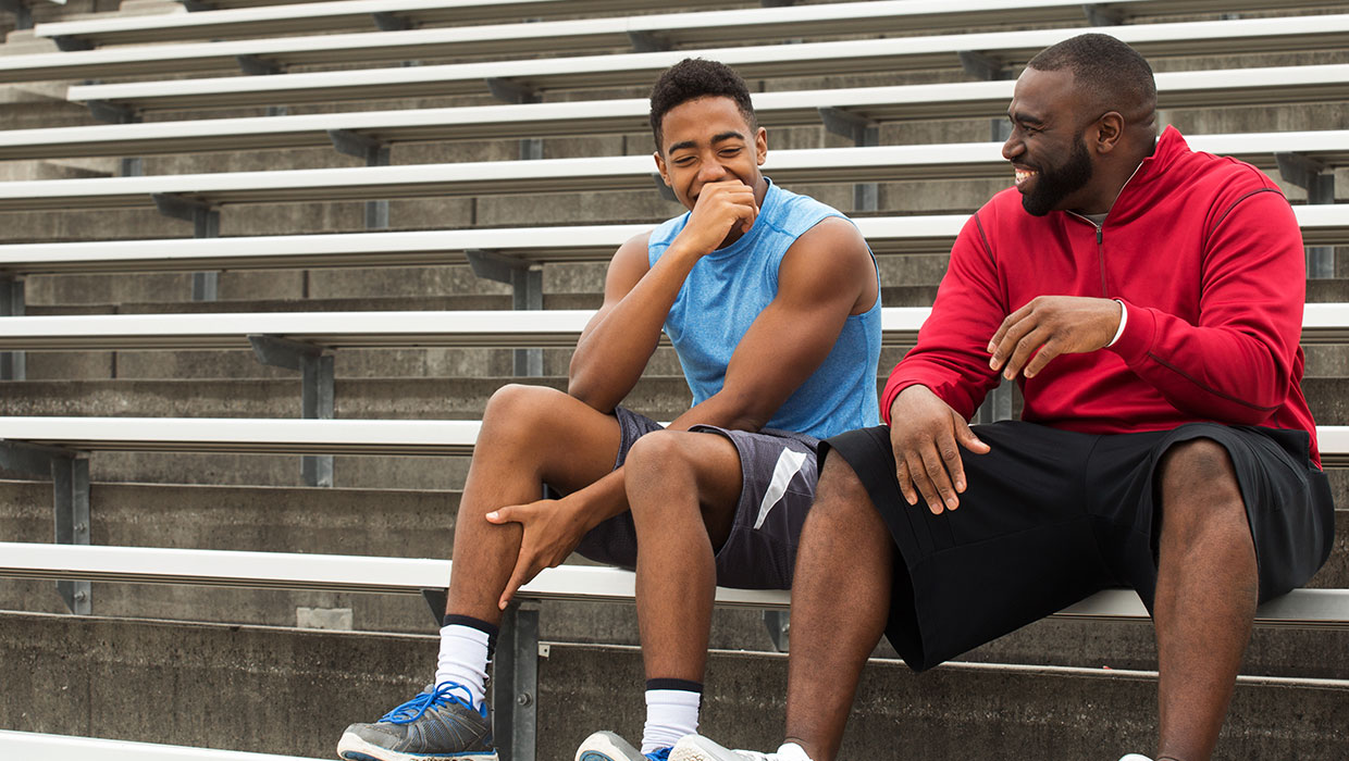 Dad with son on bleachers