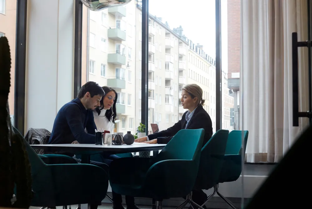 Agent meeting with young couple in office