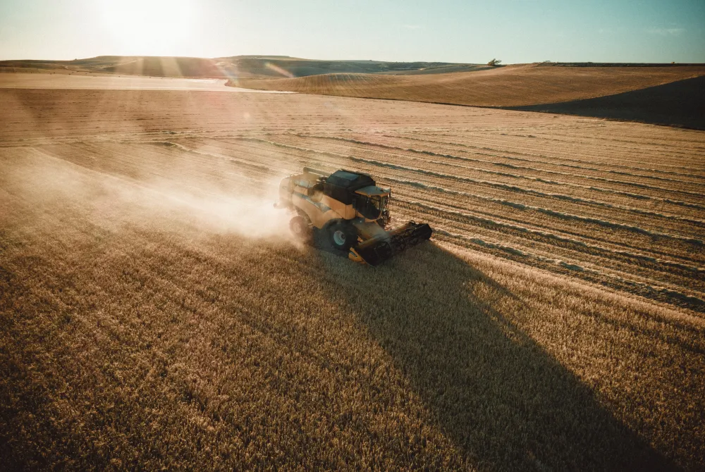 arial view of a combine in a field
