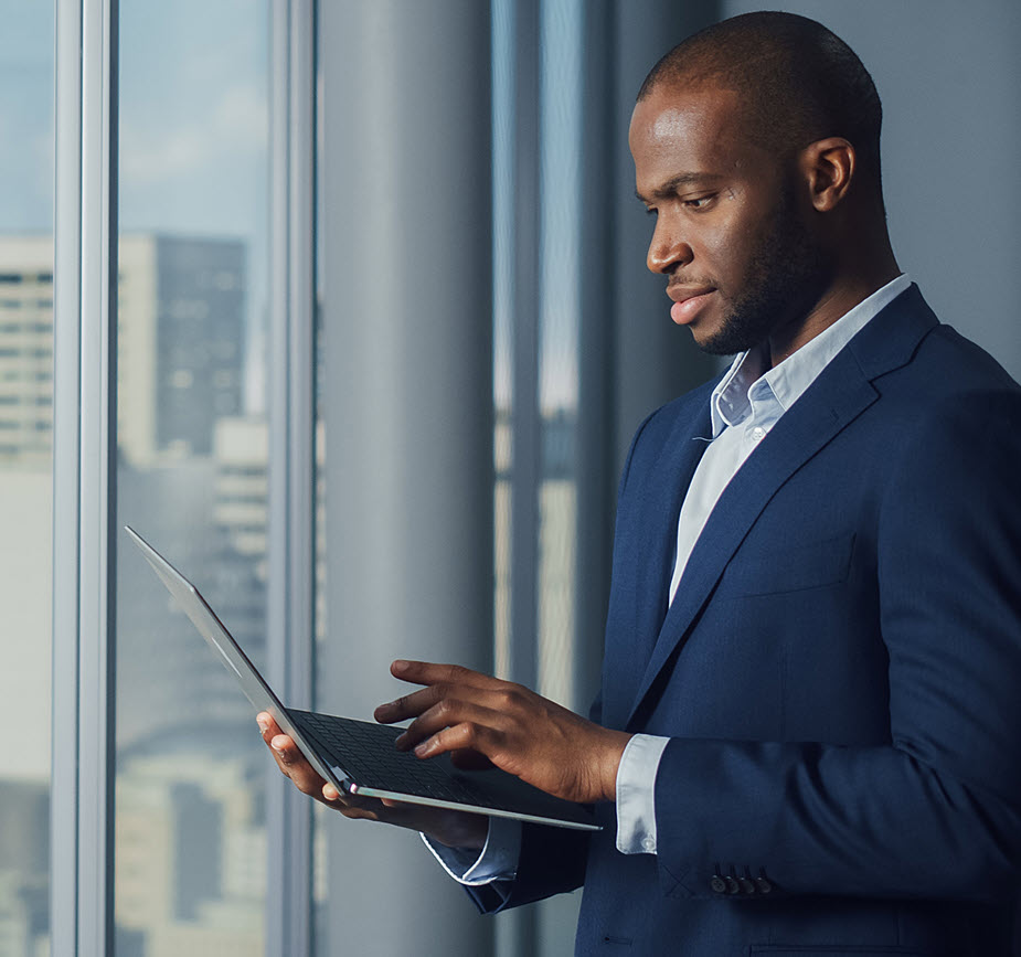 Business owner holding laptop