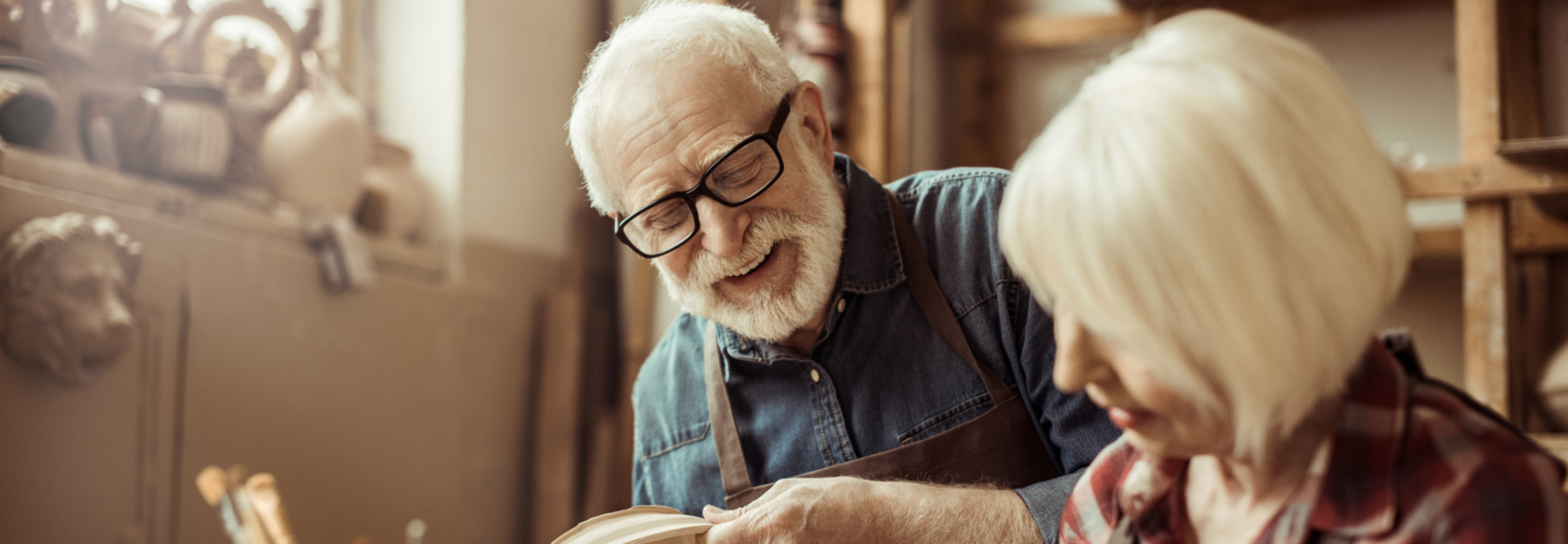 Retired couple painting pottery