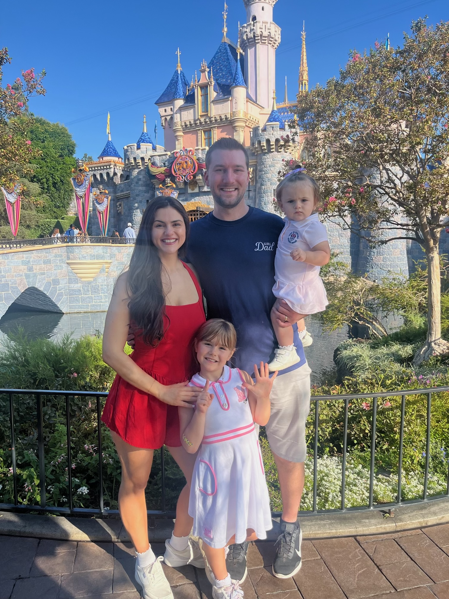 Jeremy and his wife and daughters at Disney