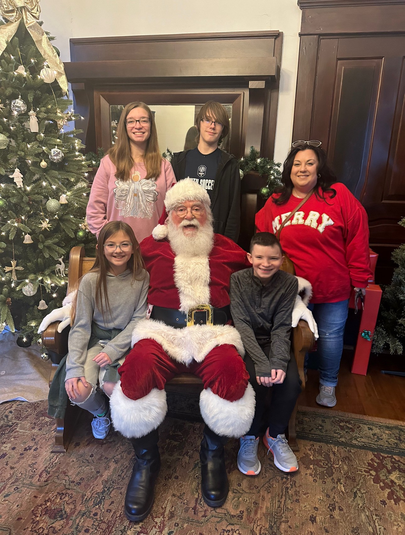 Jamie and her nieces and nephews with Santa
