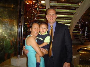 Jay Livingston posing with wife and son