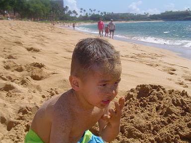 Jay Livingston's son on a beach