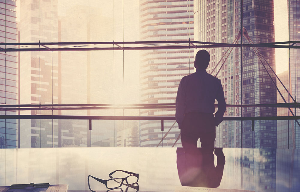 man in front of window