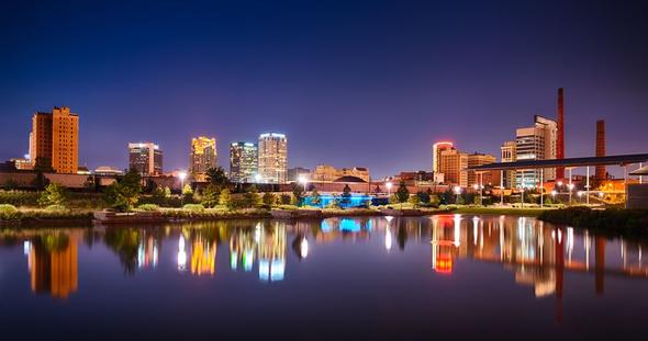 Birmingham skyline over the water at night