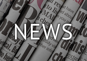 rolled newspapers text: News