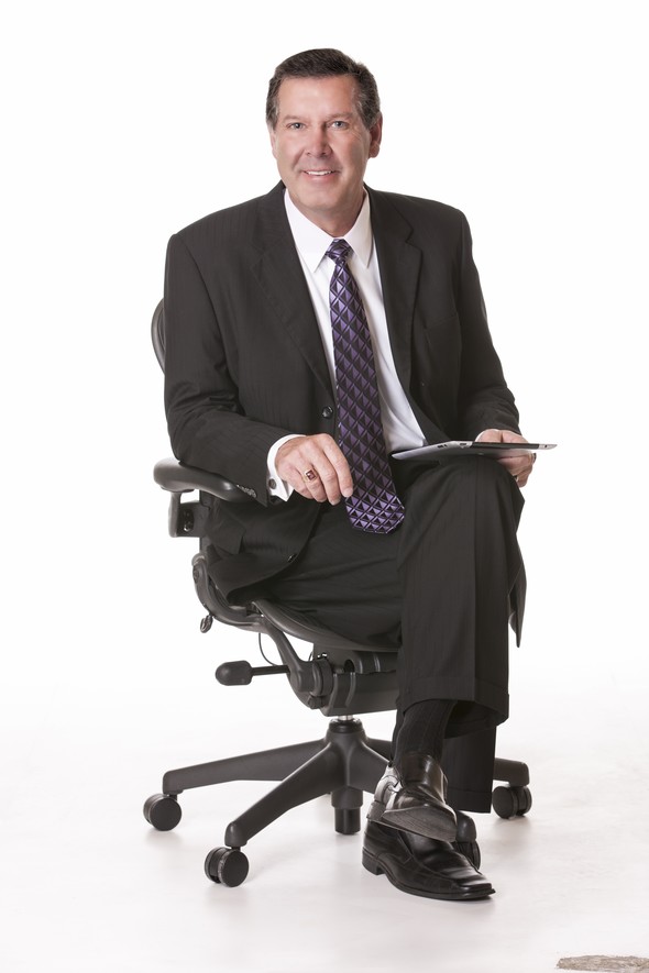 Bruce Usher in an office chair