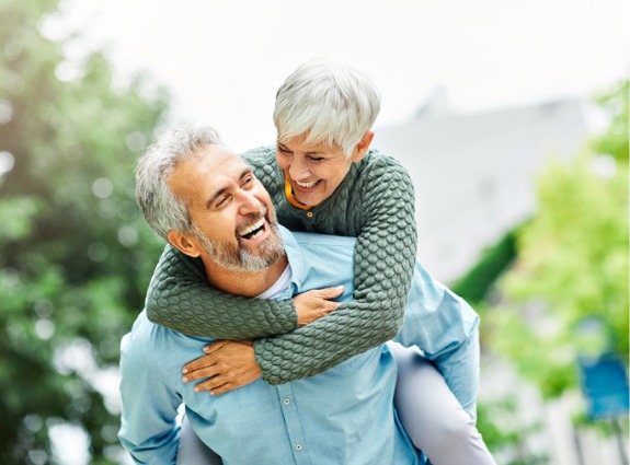 retirement-together-smiling-love-piggyback