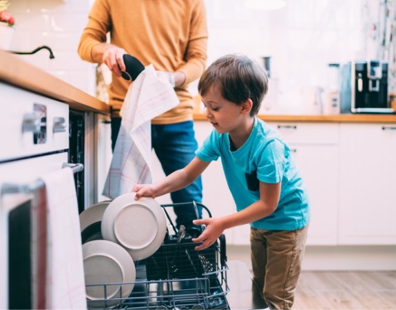 son-helping-father-with-the-dishwasher-chores-concept