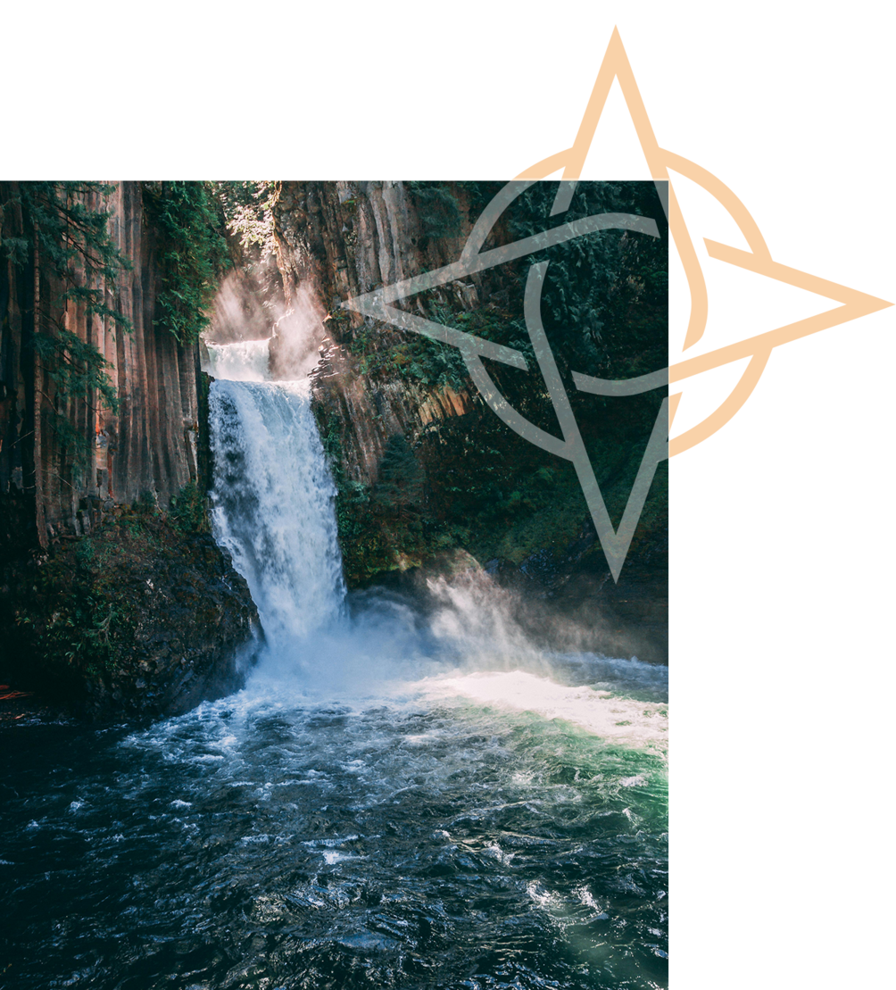 Majestic waterfall cascading into a deep blue pool, surrounded by lush Oregon forest and rocky cliffs.