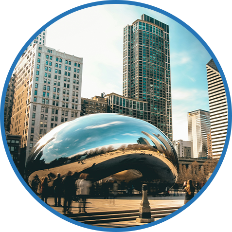 The image features Chicago's famous "Cloud Gate" sculpture, known as "The Bean," with the city’s towering skyscrapers reflected in its shiny surface. The image is framed within a blue circle.