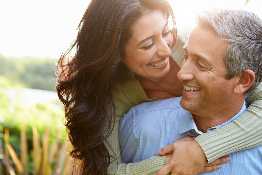 couple hugging smiling