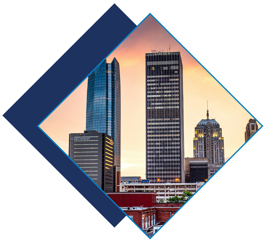 Downtown Oklahoma City skyline at sunset featuring prominent high-rise buildings