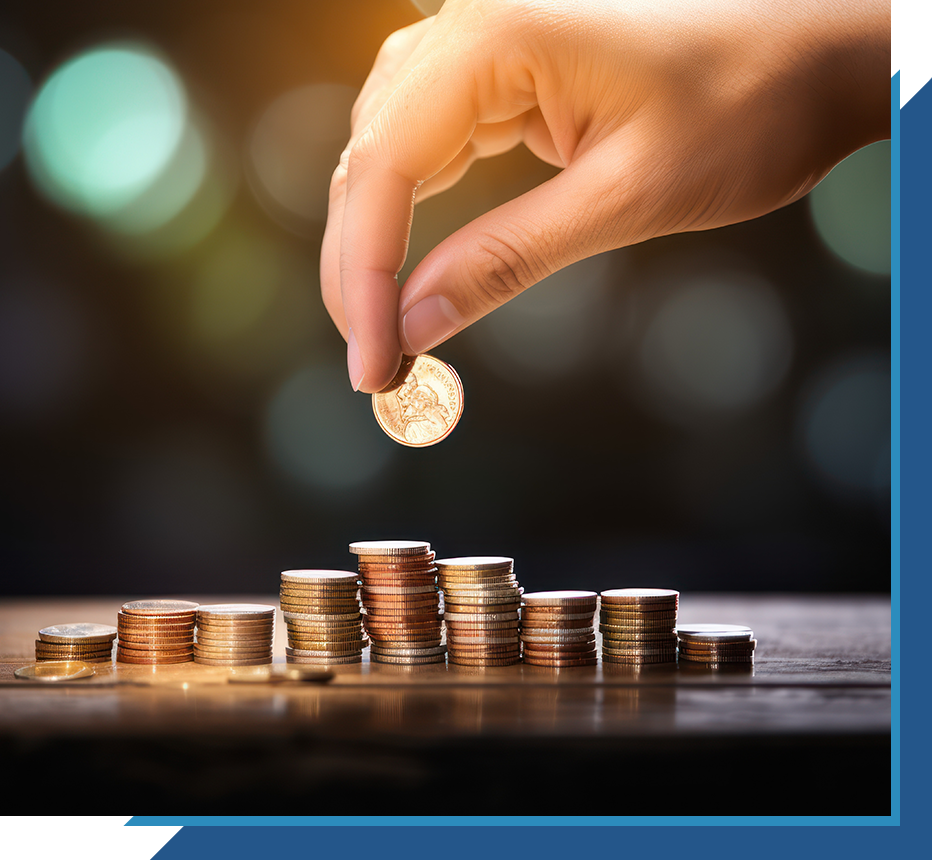 Hand placing a coin on stacked coins, symbolizing saving and financial growth.