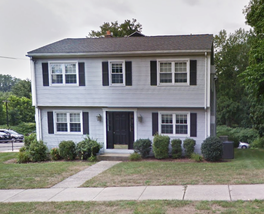 Exterior 2 story gray house with shutters South Hadley, MA