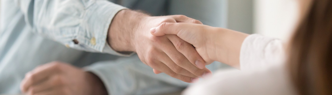 Man Shaking Woman's Hand Image