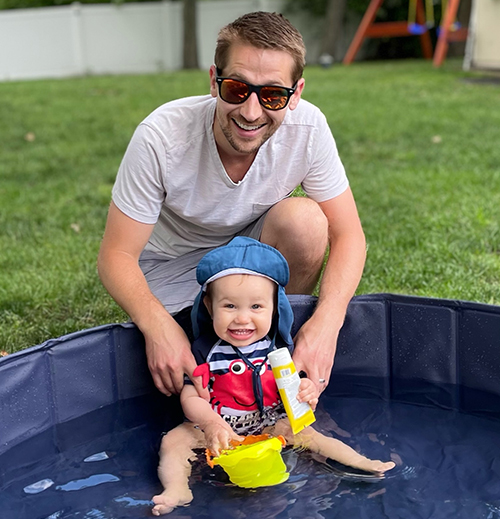 James With Son Theo in Kiddie Pool Image