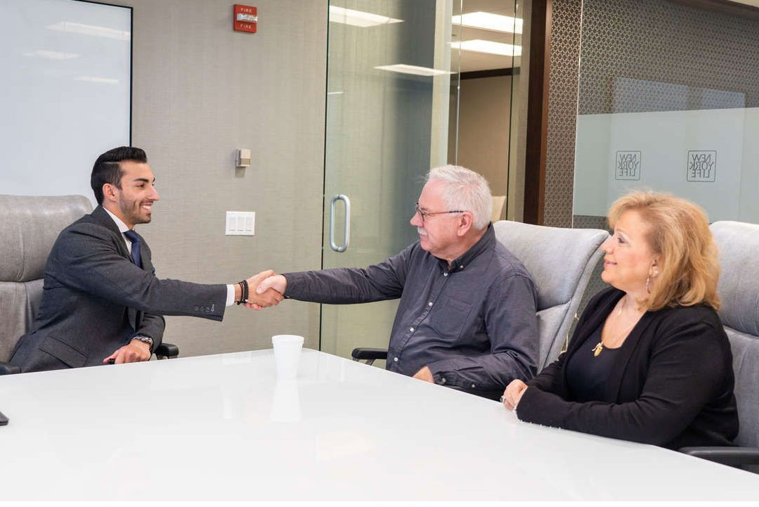 Vincent Pack shaking hands with clients