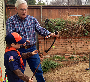 Stuart Teaching Archery to a Cub Scout Image