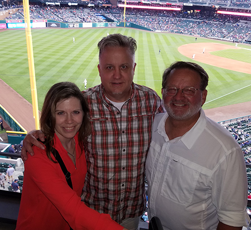 Steve and Wife With Another Guy at Baseball Game Image