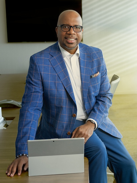 Broderick Young with laptop portrait