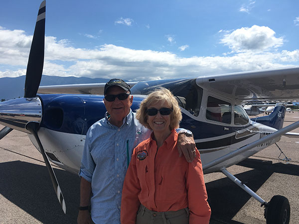 Steve Maus & Wife Standing in Front of Cessna 182 Skylane In Colorado Image