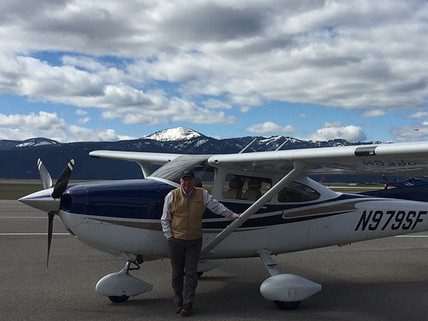 Steve Maus Standing in Front of Cessna 182 Skylane In Colorado Image