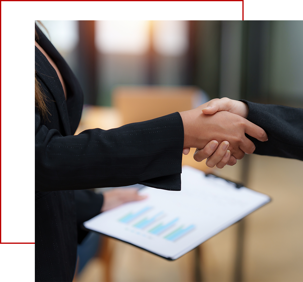 Photo of two business people shaking hands