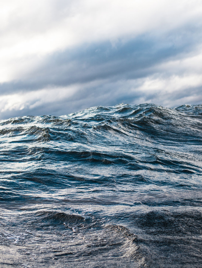 close up of ocean waves blue gray sky