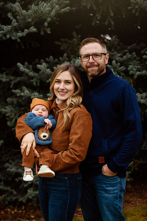Family photo of Makena, her husband, and their son