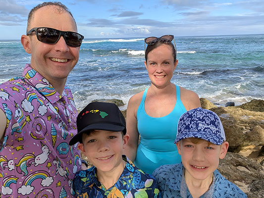 Theresa with her husband and children at the beach