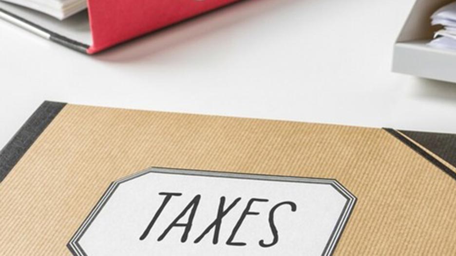 folder with the word "Taxes" on the label