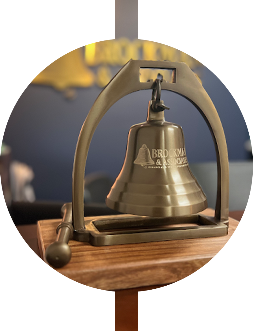 Photo of a bell with the company's DBA