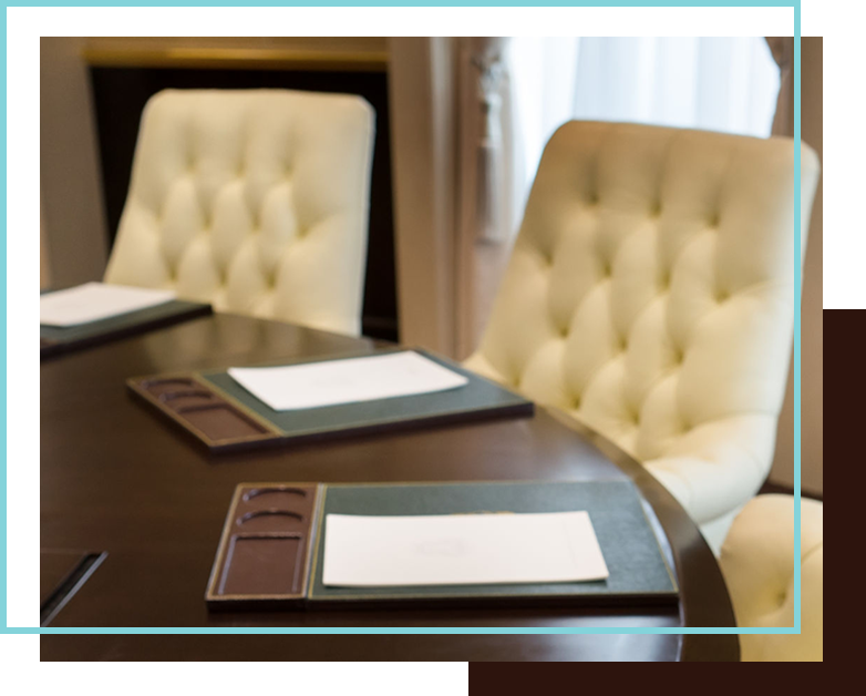 Photo of a conference room with a table and chairs