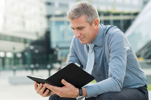 Successful Professional reading a planner