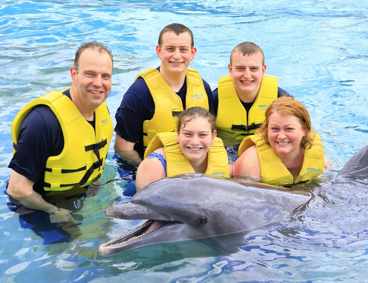 Mike 1 > Family with a dolphin in the water