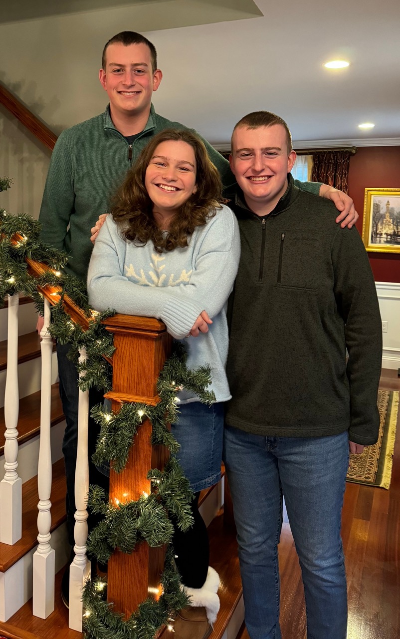 Mike 5 > Mike's children posing by the stairs at Christmas