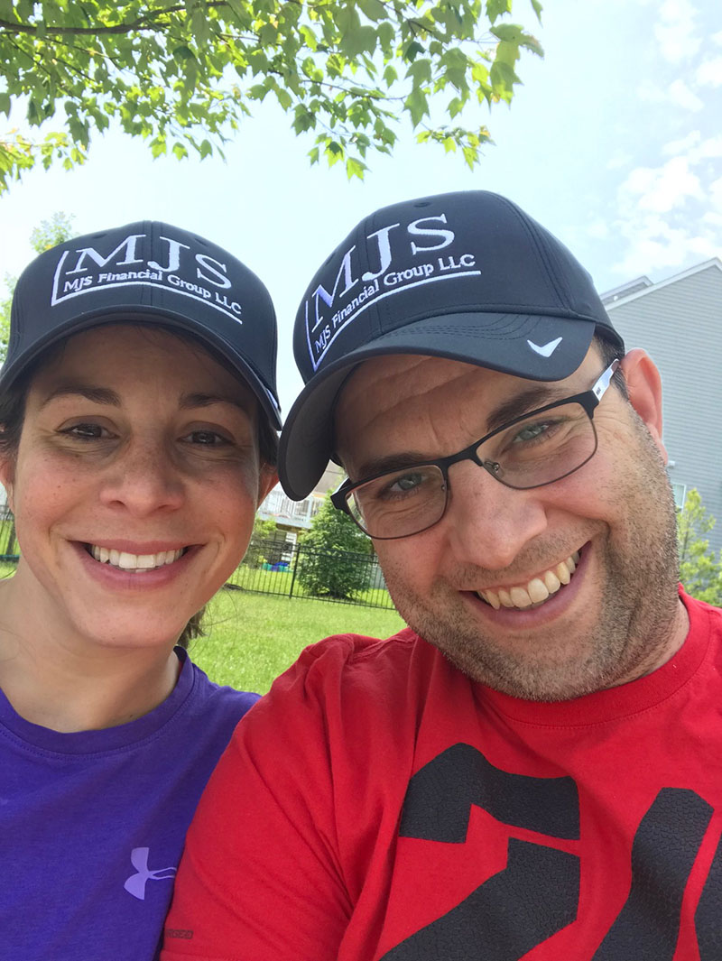 Marc with wife wearing MJS hats