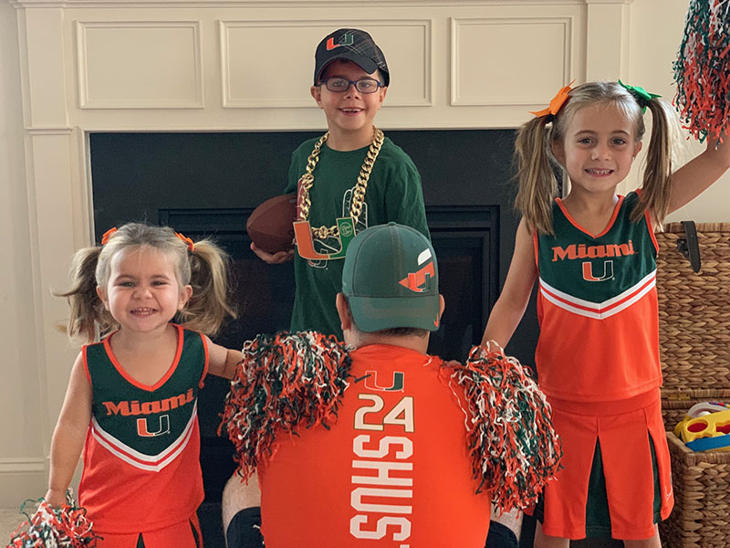 Kids dressed as University of Miami Cheerleaders