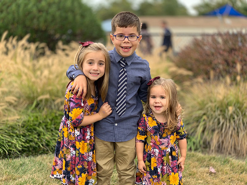 Kids dressed in Sunday best in the park