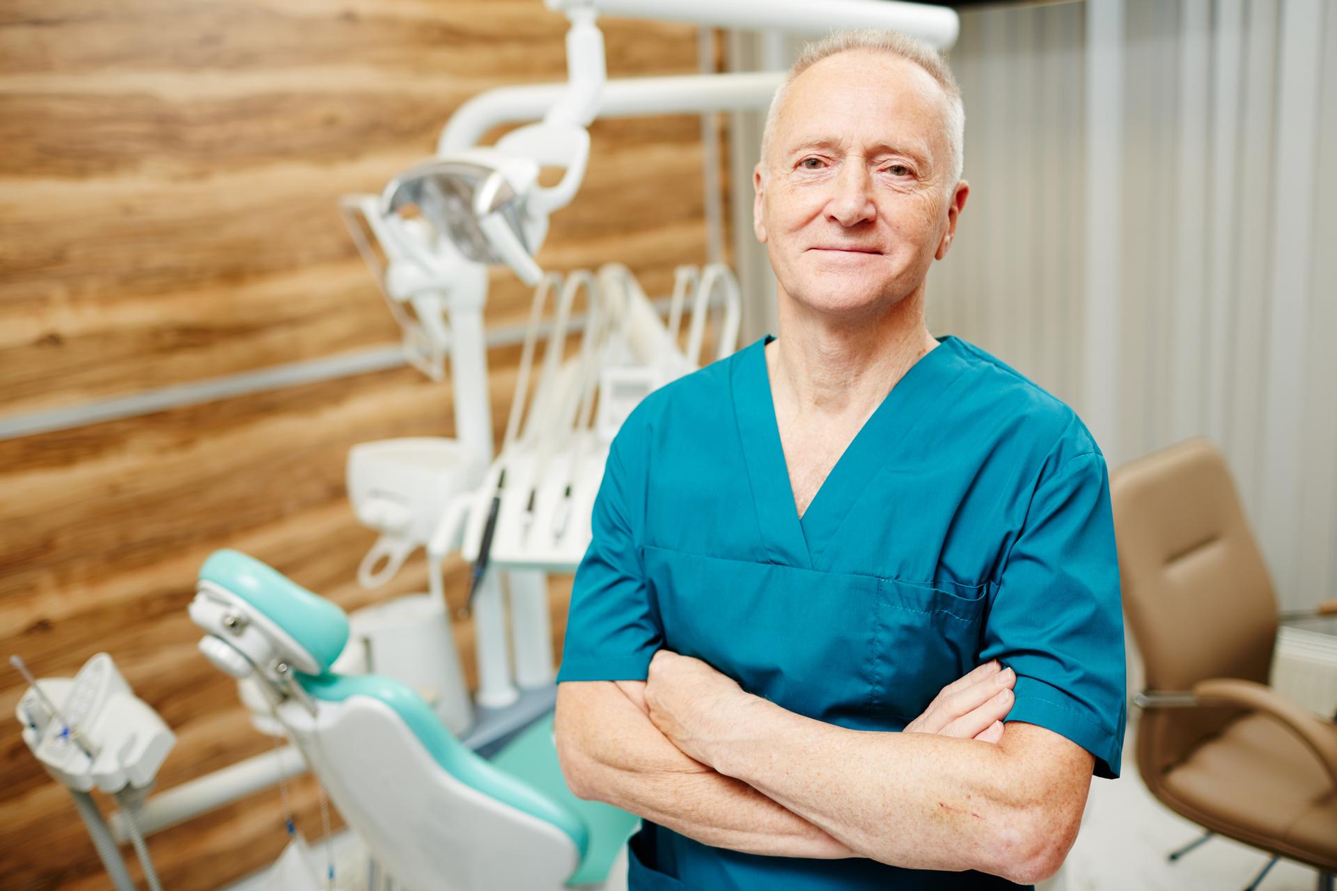 Dental > Dentist in front of a dentist chair