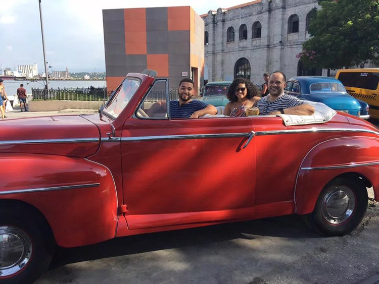 Mark Howard in the back seat of an old car