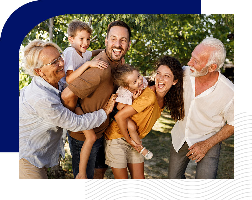 Multigenerational family laughing and playing outside
