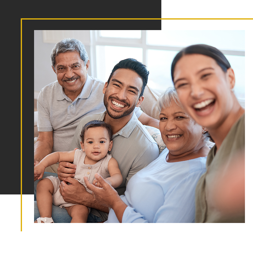 A joyful multigenerational family shares smiles and laughter together at home