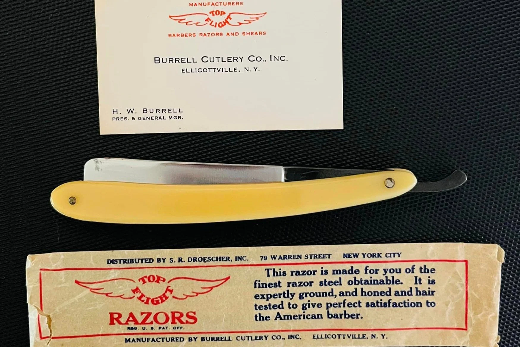 Picture of vintage business card, razor and packaging