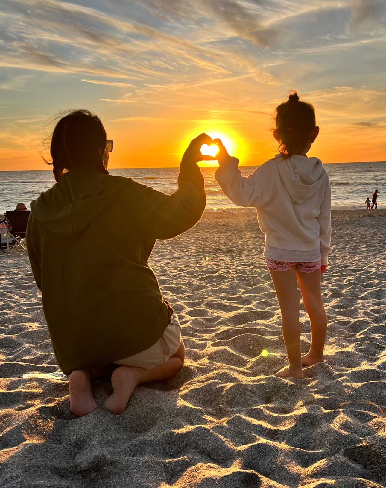 Eunice with daughter and sunset
