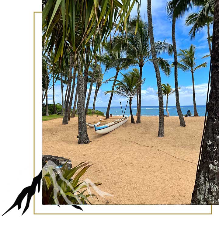 Beach with small white small canoe boat